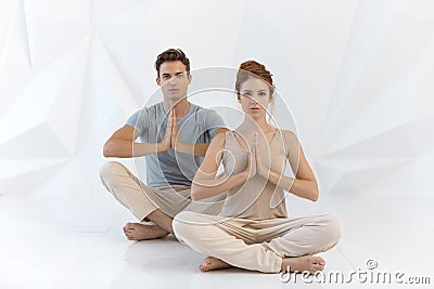 Young couple in yoga pose Stock Photo