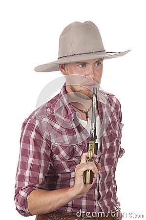 Young cowboy with drawn pistol Stock Photo