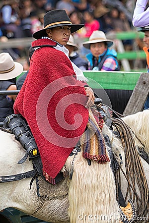 Young cowboy sitting in saddle Editorial Stock Photo
