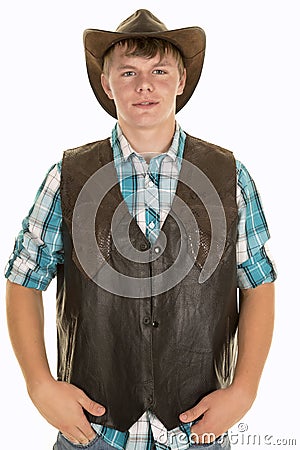 Young cowboy in vest looking Stock Photo
