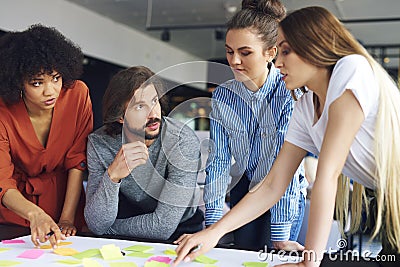 Young coworkers sharing concepts together Stock Photo