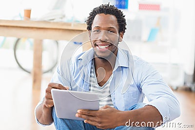 Young creative businessman scrolling on the tablet Stock Photo