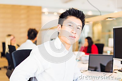 Young Creative Team In Their Office Stock Photo