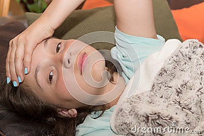 Young cute Caucasian girl have a headache Stock Photo