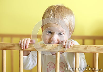 Young cute child in crib Stock Photo