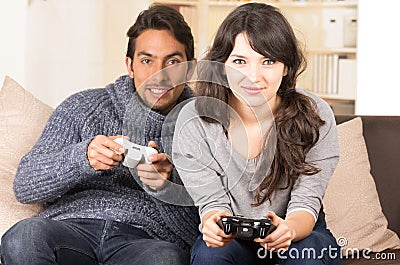 Young cute couple playing video games Stock Photo