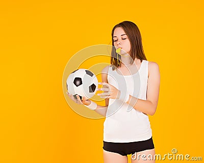 Young cute girl with whistle, studio Stock Photo