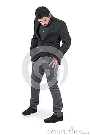 Young cute guy holding hands in pockets Stock Photo