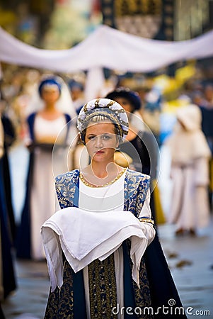 Young damadel Middle Ages at the Palio with flowers Editorial Stock Photo