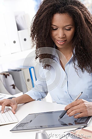 Young designer using drawing table Stock Photo