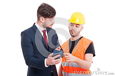 Young director showing something to constructor or engineer Stock Photo