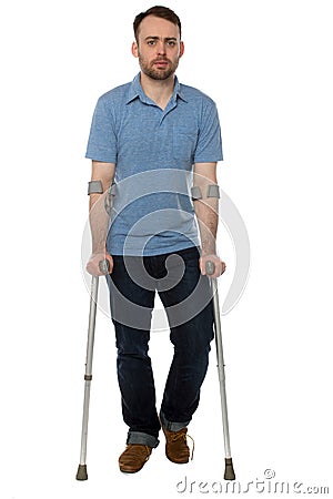 Young disabled man walking with forearm crutches Stock Photo