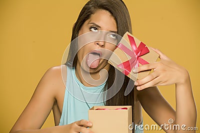 Young disappointed woman opening a present box Stock Photo