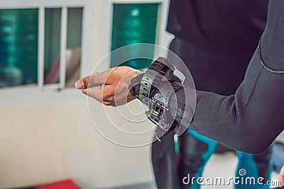 Young diver preparing an underwater compass for diving Stock Photo