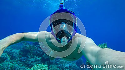 young diver in an underwater mask Stock Photo