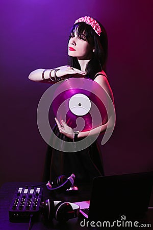 Dj headphone equipment disco girl party retro vintage ultraviolet mixer young woman vinyl glamor valentine`s day plastic pink Stock Photo