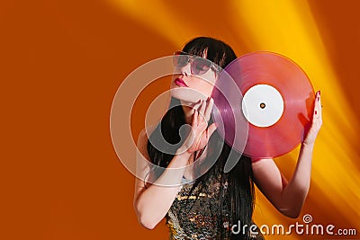 Dj disco girl party retro vintage yellow orange young woman vinyl glamour light sun sunlight set sunrise summer morning Stock Photo