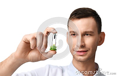 Young doctor dentist hold dental implant Stock Photo