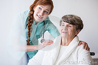 Young doctor and elderly patient Stock Photo