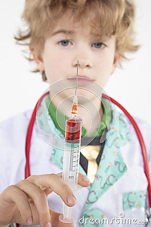 Young doctor holds a syringe in his hand filled with vaccine Stock Photo