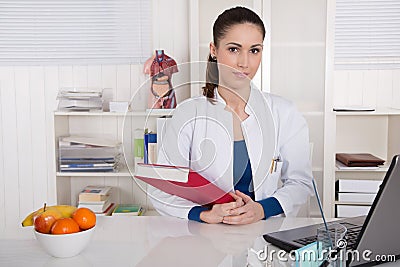 Young doctor informing about healthy nutrition. Stock Photo