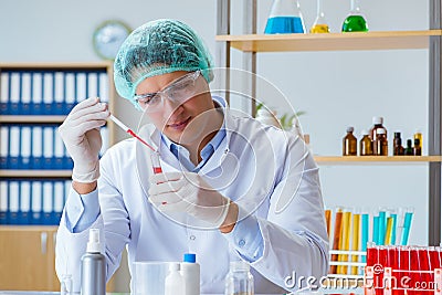 The young doctor working on blood test in lab hospital Stock Photo