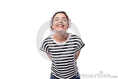 young dreamy well-groomed curly woman with black hair in a summer striped t-shirt Stock Photo