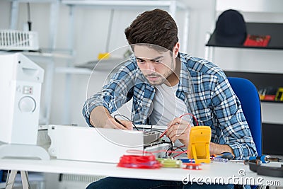 young electrician measuring earth resistance Stock Photo