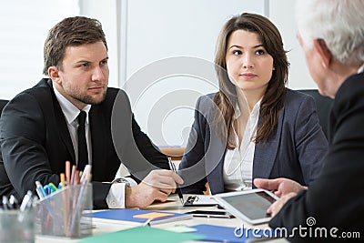 Young employees talking with boss Stock Photo