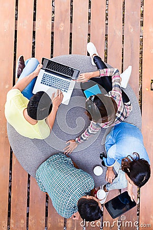 Young employees using modern wireless technology while working Stock Photo