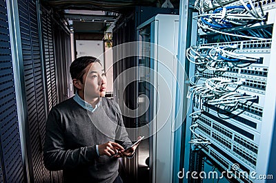 Young engineer businessman in server room Stock Photo