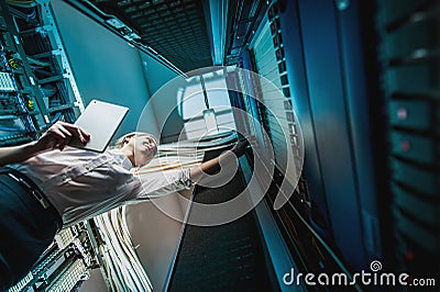 Young engineer businesswoman in server room Stock Photo