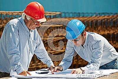 Young engineer and senior foreman Stock Photo