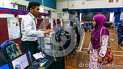 Young engineering student presenting his product at the Final Year Project exhibition event in UniKL MFI Editorial Stock Photo