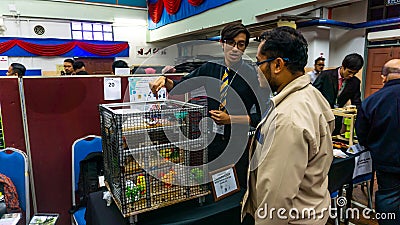 Young engineering student presenting his product at the Final Year Project exhibition event in UniKL MFI Editorial Stock Photo