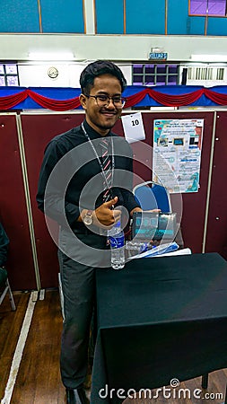 Young engineering student presenting his product named I-BOX at the Final Year Project exhibition Editorial Stock Photo