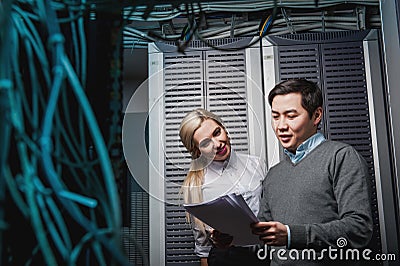 Young engineers businessmen in server room Stock Photo