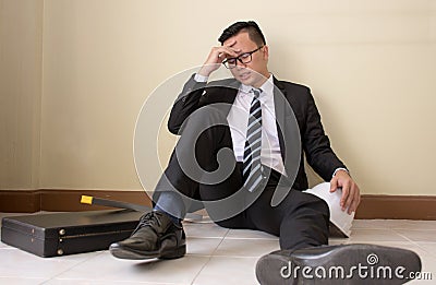 Engineers fail to make mistakes in their work and business sit down on the floor. Stock Photo