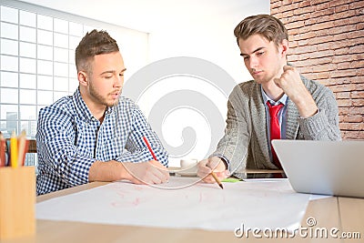 Young engineers at workplace Stock Photo