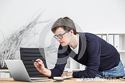 Young enterpreneur in glasses working Stock Photo
