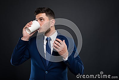 Young entrepreneur drinking refreshing hot espresso Stock Photo