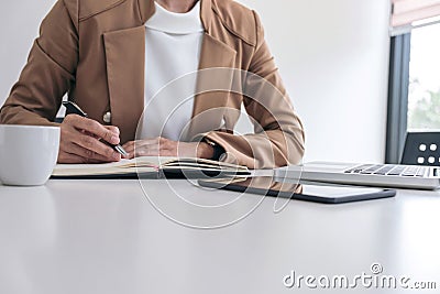 Young Entrepreneur woman manager working indoors at a modern off Stock Photo