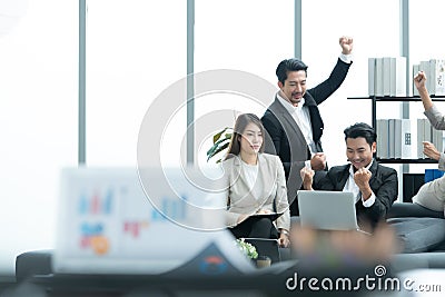Young entrepreneurs in Asia Be notified of project approval results presented to clients. They cheered happily as they took a Stock Photo