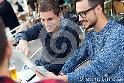 Young entrepreneurs working at coffee bar. Stock Photo