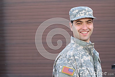 Young ethnically ambiguous American soldier and copy space on the right Stock Photo