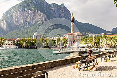 Young European couple admires view on the bay of lake Como and admire the main attractions of the city St. Nicholas di Editorial Stock Photo