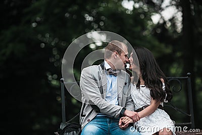 https://thumbs.dreamstime.com/x/young-european-couple-cuddling-park-bench-beautiful-having-great-time-background-city-57523064.jpg