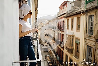 Young european woman spending spa free time home.Self care,staying home.Enjoying view on the balcony.Relaxing at home.Hotel room Stock Photo