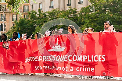 young european women march holding banner in protest against immigration policies and in support Editorial Stock Photo