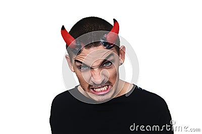 Young evil man with horns on his head Stock Photo